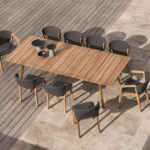 Ethimo's Knit range XL dining table with dining chairs in use.