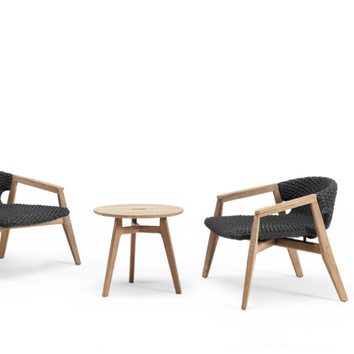 Ethimo's Knit collection lounge armchairs and side table.