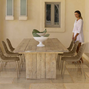 6 Panama dining chairs around a wooden dining table.