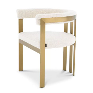 Luxurious Dining Chair Clubhouse by Eichholtz in boucle cream with brushed brass frame, savona grey velvet with brushed brass frame or savona midnight blue velvet with polished stainless steel frame