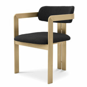 Luxurious Dining Chair Donato by Eichholtz in boucle black or boucle white with a brushed brass base. Rounded backrest with two armrests