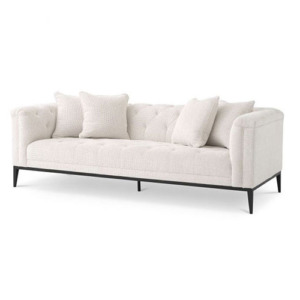 Designer luxurious Sofa Cesare by Eichholtz available in pebble grey or granite grey upholstery finish. Feature gunmetal base finish and includes 4 x scatter cushions. Buttoned back design and embroidered stitching