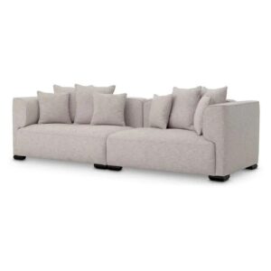 Luxurious designer Sofa Xylon by Eichholtz in attesso beige with black feet. Includes cushions