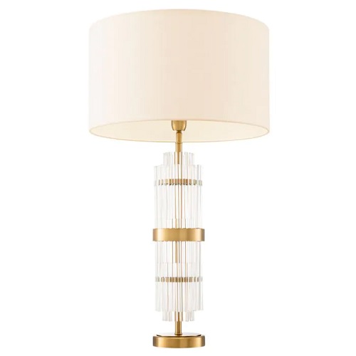 Designer Table Lamp East by Eichholtz in antique brass finish with clear glass. Includes white shade